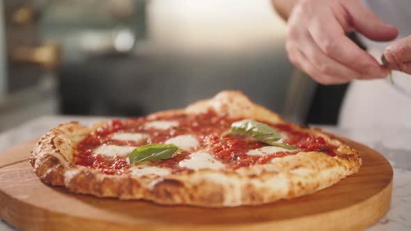 Italian Chef Making Margaritta Pizza with Tomato Sause and Mozzarella Traditional Food in Italy High alt