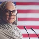Portrait of Positive Female Politician in Hijab against U.S. Flag - VideoHive Item for Sale