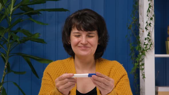 Middle Aged Woman Takes a Pregnancy Test and She Reads That She is Pregnant She Explodes in a Moment