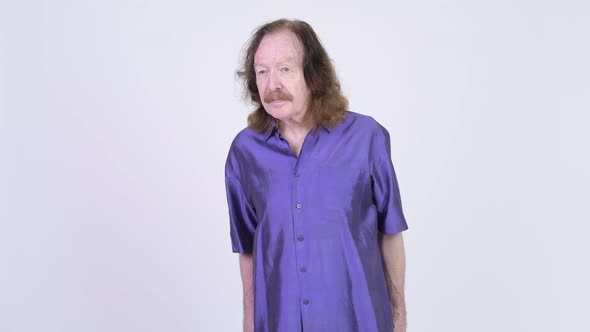 Senior Man with Mustache Wearing Purple Silky Shirt alt