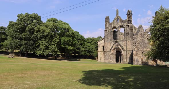 The famous Kirkstall Abbey showing the ruined Cistercian monastery in Kirkstall, Leeds in the UK