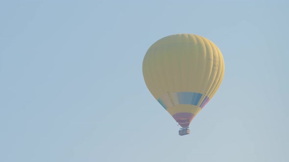 Hot Air Colorful Balloon Fly Over the White Limestone Mountains