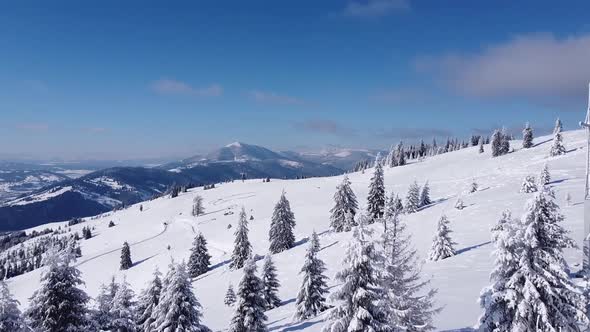 Aerial Flying Over the Mountains in the Winter