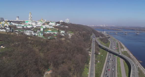 Aerial View of Cars at Traffic Instersection by the Dnipro River Embankment alt