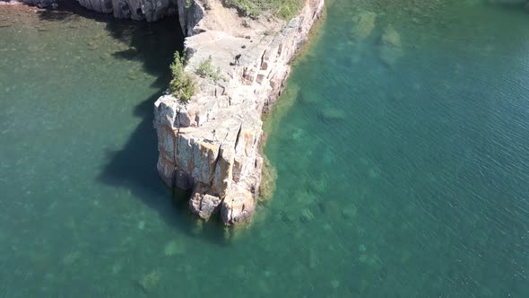 Birds eye vie of a crystal clear blue/ green water at lake superior on a sunny morning alt