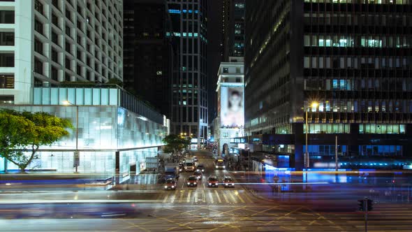 Wide shot of intersection in the central district of big city Night Traffic alt
