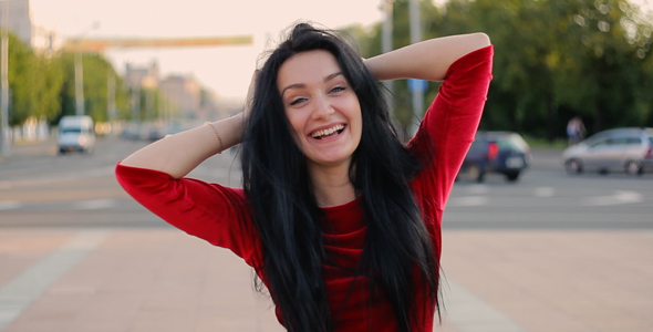 Young attractive girl in red dress