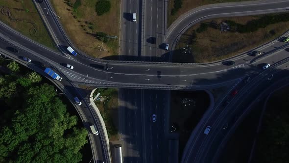 Top View Car Moving on Freeway Overpass. Car Traffic on Highway Intersection alt