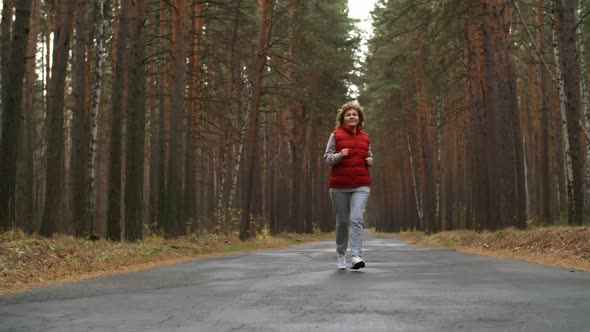 Aged Active Woman Jogging Outdoors alt