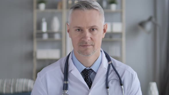 Portrait of Serious Doctor with Grey Hairs alt