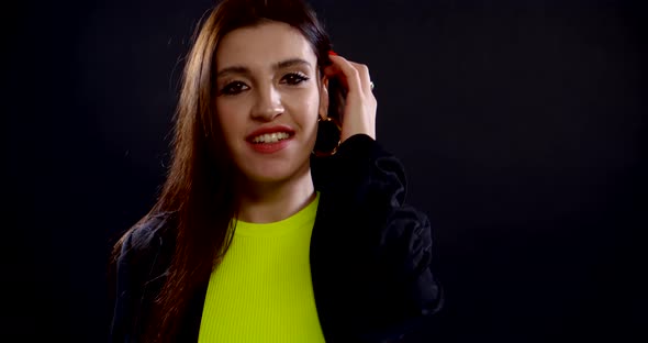 Attractive Young Brunette Is Dancing Alone and Looking at Camera Seductively alt