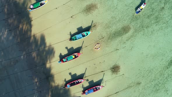 Amazing aerial Top view Longtail fishing boats in the tropical sea alt