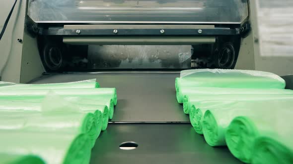 Green Plastic Bag Production Line. Close Up alt