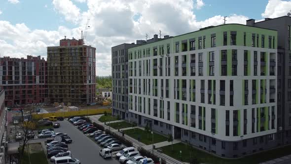 Aerial drone view of a flying over the modern residential building. alt