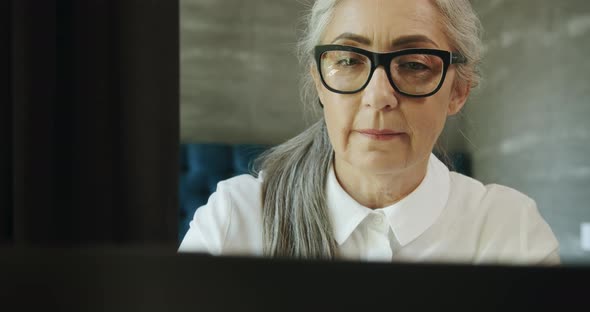 Elderly Woman with Laptop