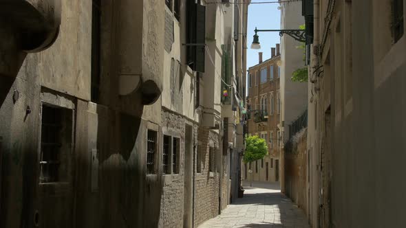 Narrow paved street and buildings