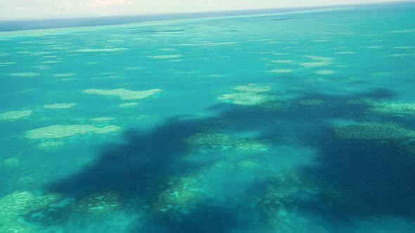 The Great Barrier Reef As Seen From the Airplane. Beautiful Ocean Colors, Aerial View. Slow Motion alt