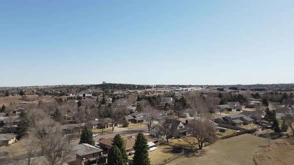 View of rural community of fall day with blue sky and hazy clouds in distance.