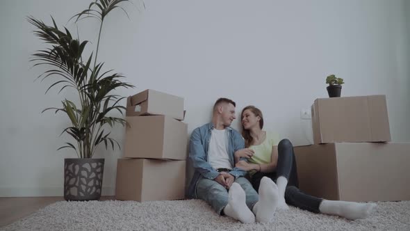 Young Couple Moving at a New Home alt