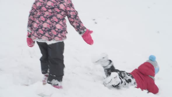 Vacation Game Family Concept Slomo Authentic Two Happy Preschool Toddler Kids Siblings Slide Down alt