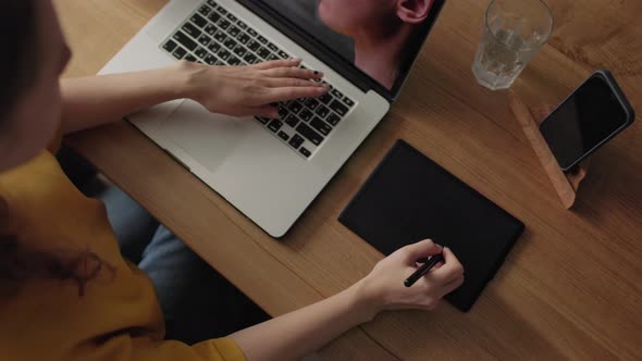 A Retoucher Girl Working at Home Editing Photos alt