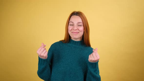 Young Red Hair Woman Posing Isolated on Yellow Color Background Studio alt
