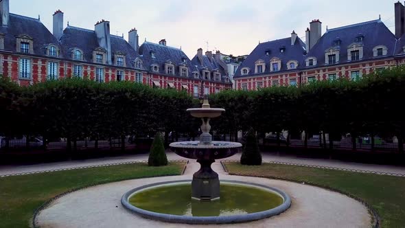 Drone camera rising and gradually showing panorama of Paris city over historic houses with arcades o alt