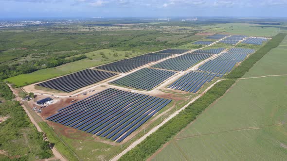 Aerial panoramic view over photovoltaic farm in El Soco, San Pedro de Macoris alt