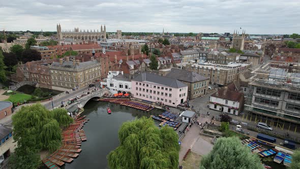 Punts on river Cam Cambridge city in background drone aerial view 4K footage alt