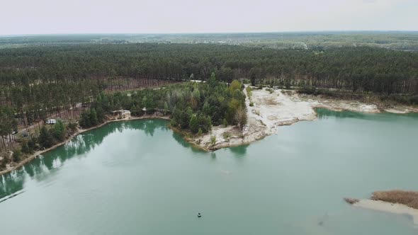 Aerial View of Lake Pine Forest on the Background alt