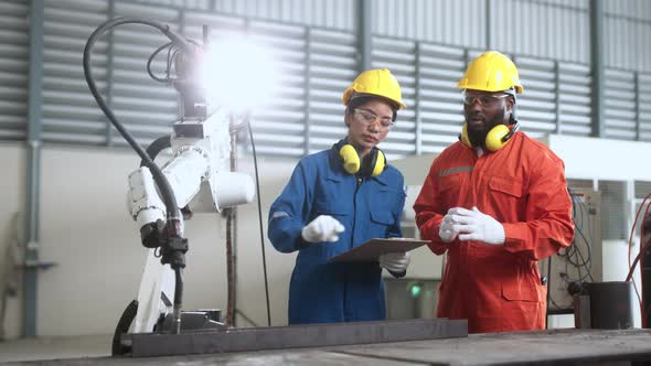 engineer cooperation male and female technician maintenance control relay robot alt