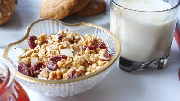 Cereal Breakfast in Bowl Bread and Honey on White Background alt