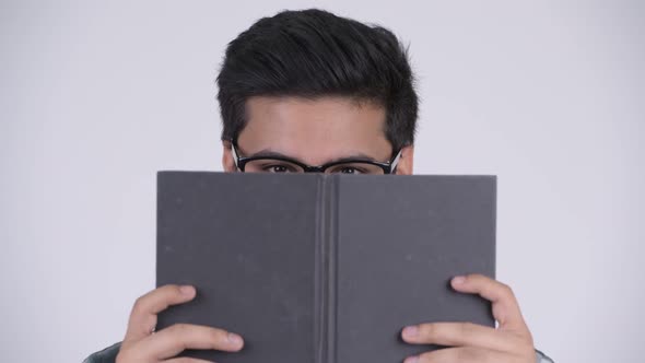 Young Bearded Indian Nerd Man Revealing Face alt