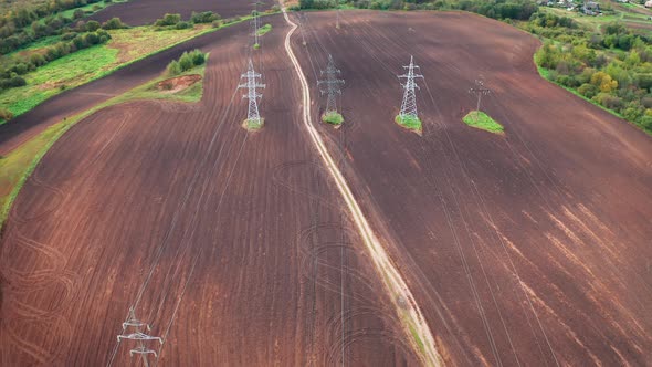 Aerial View Of Country Area With Electricity Lines And Agricultural Fields