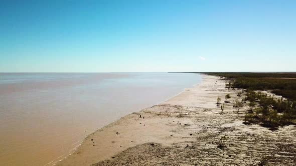 Forward and upward flying aerial shot of tidal mudflats in King Sound, Australia where the second la alt