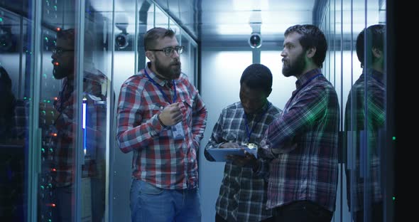 Coworking IT Engineers Diagnosing Server Hardware alt