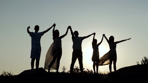 Happy Family Parents Holding Hands Raised Their Hands Up alt
