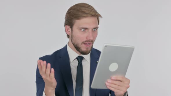 Young Businessman Reacting to Loss on Tablet on White Background alt