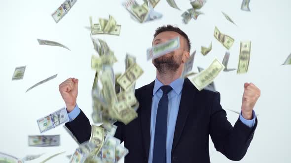 Slow Motion of Formally Dressed Man is Delighted with the Fact That a Lot of Dollar Bills are Fall alt