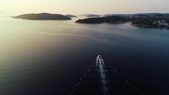 Aerial view of luxury speed boat sailing in Mediterranean sea in Europe. 
