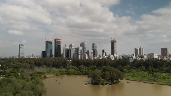 Ecological Contrast Cityscape with Skyscrapers Against a Green Park with Green Trees