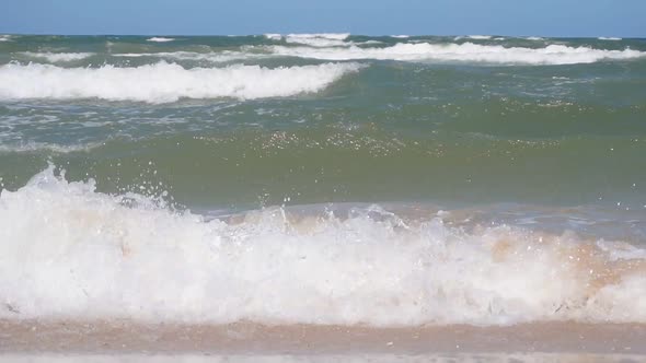 Beautiful Waves on the Shore of a Sandy Beach
