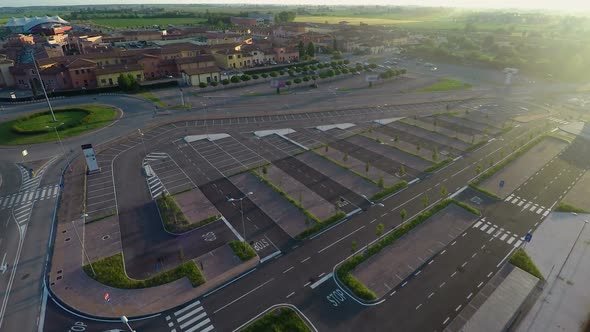 Drone Flying Over Parking, Checking Free Places at Outlet Village Mantova, Italy alt