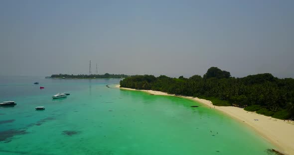 Wide angle above abstract view of a paradise sunny white sand beach and aqua blue ocean background i alt
