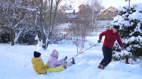 Family of Dad and Kids Vacation on Christmas Eve Outdoors