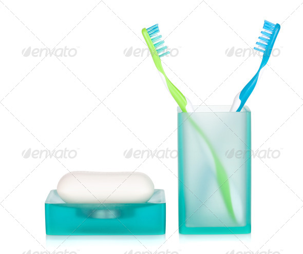 Two toothbrushes and soap