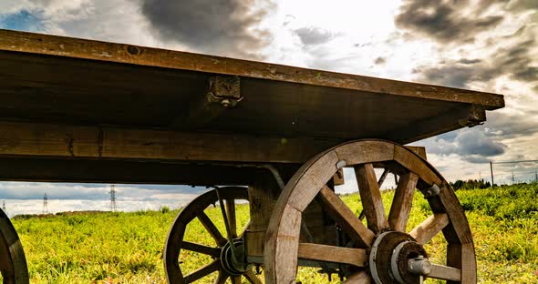 Antique Wooden Cart Standing Alone in a Field, Beautiful Autumn Landscape, Hyperlapse, Time Lapse alt