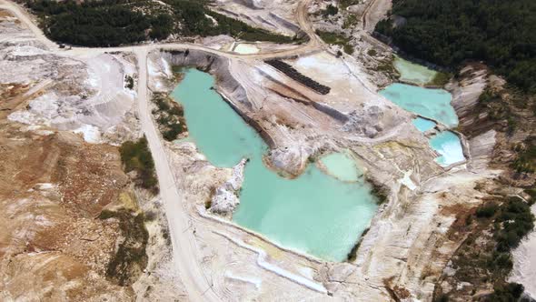 Aerial View Quarry Extraction Porcelain Clay Kaolin with Turquoise Water and White Shor