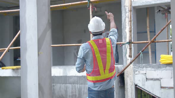portrait of young site engineer manager inspection discuss with engineer staff team alt