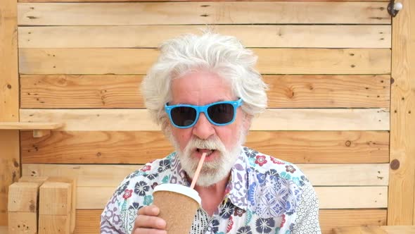 Handsome senior aged alternative diverse caucasian mature funny man in front of the camera alt